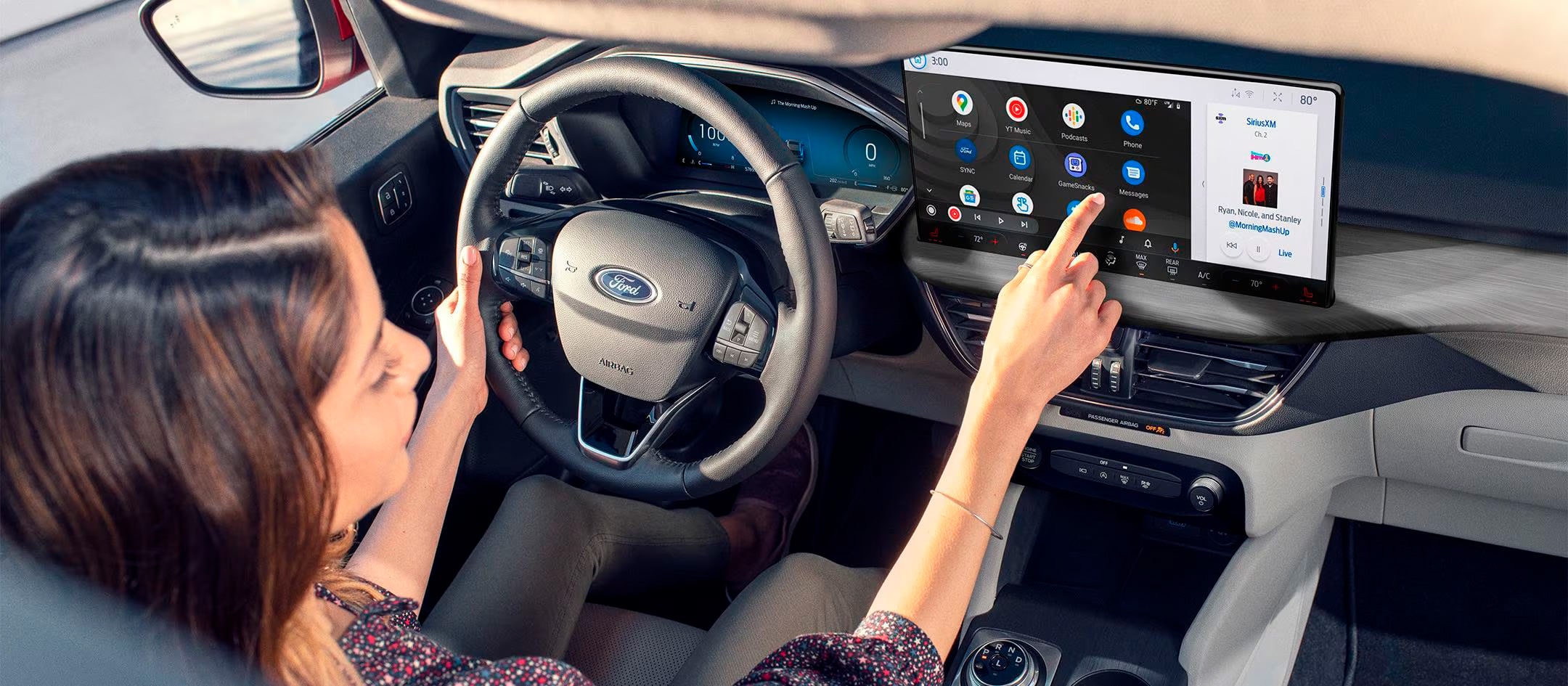 A driver taps through their playlist on the in-vehicle touchscreen of their Ford vehicle. 