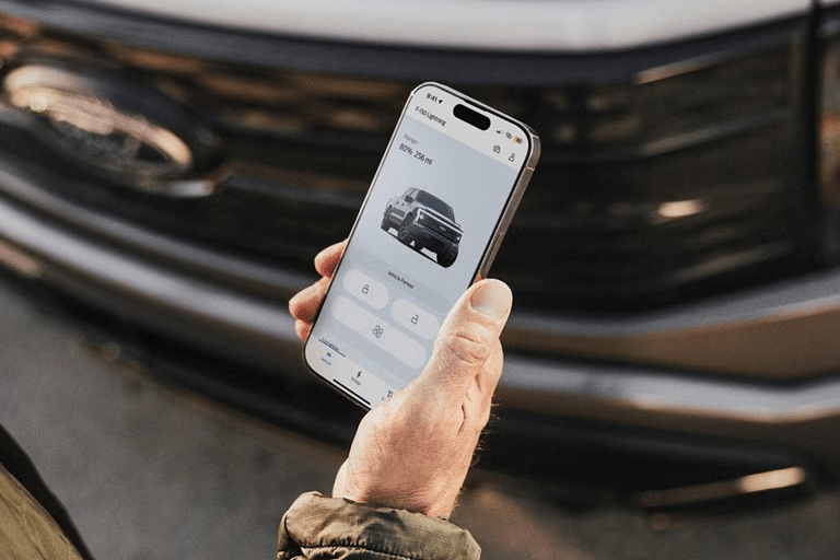 A Ford owner connects to their Ford F-150 Lightning through the FordPass App. 
