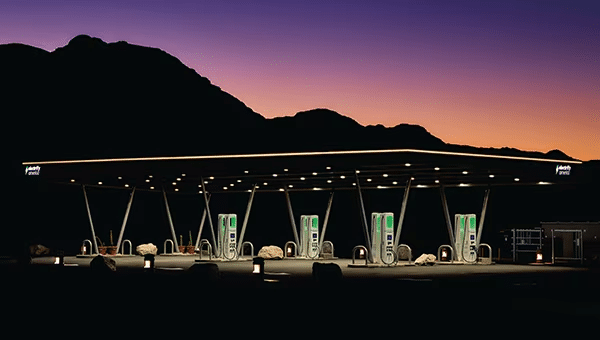 View of a Blue Oval Charge Network public charging station at twilight