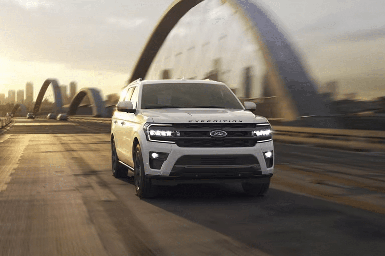 Ford Expedition driving across a bridge.