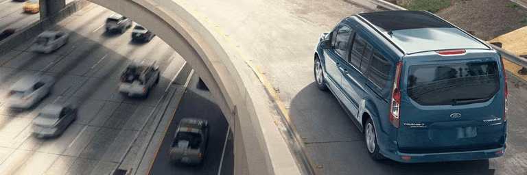Ford Transit driving over a curved overpass