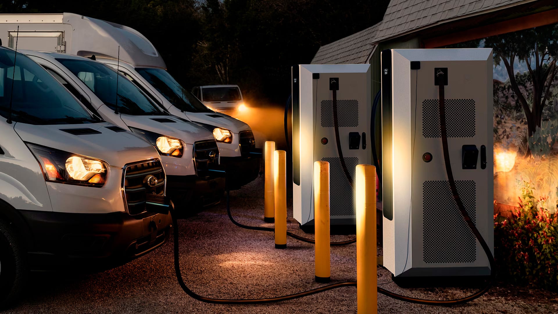 Fleet of vehicles charging at charging station.