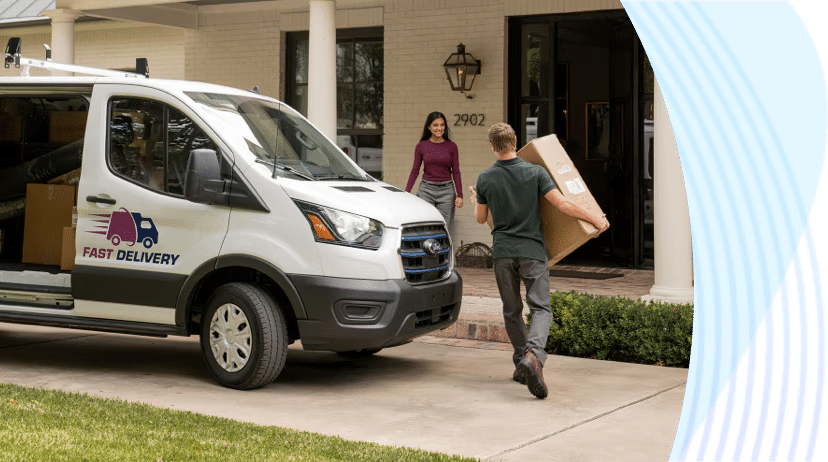 Ford Etransit parked in front of a residential home. A man is delivering a large package to a resident.